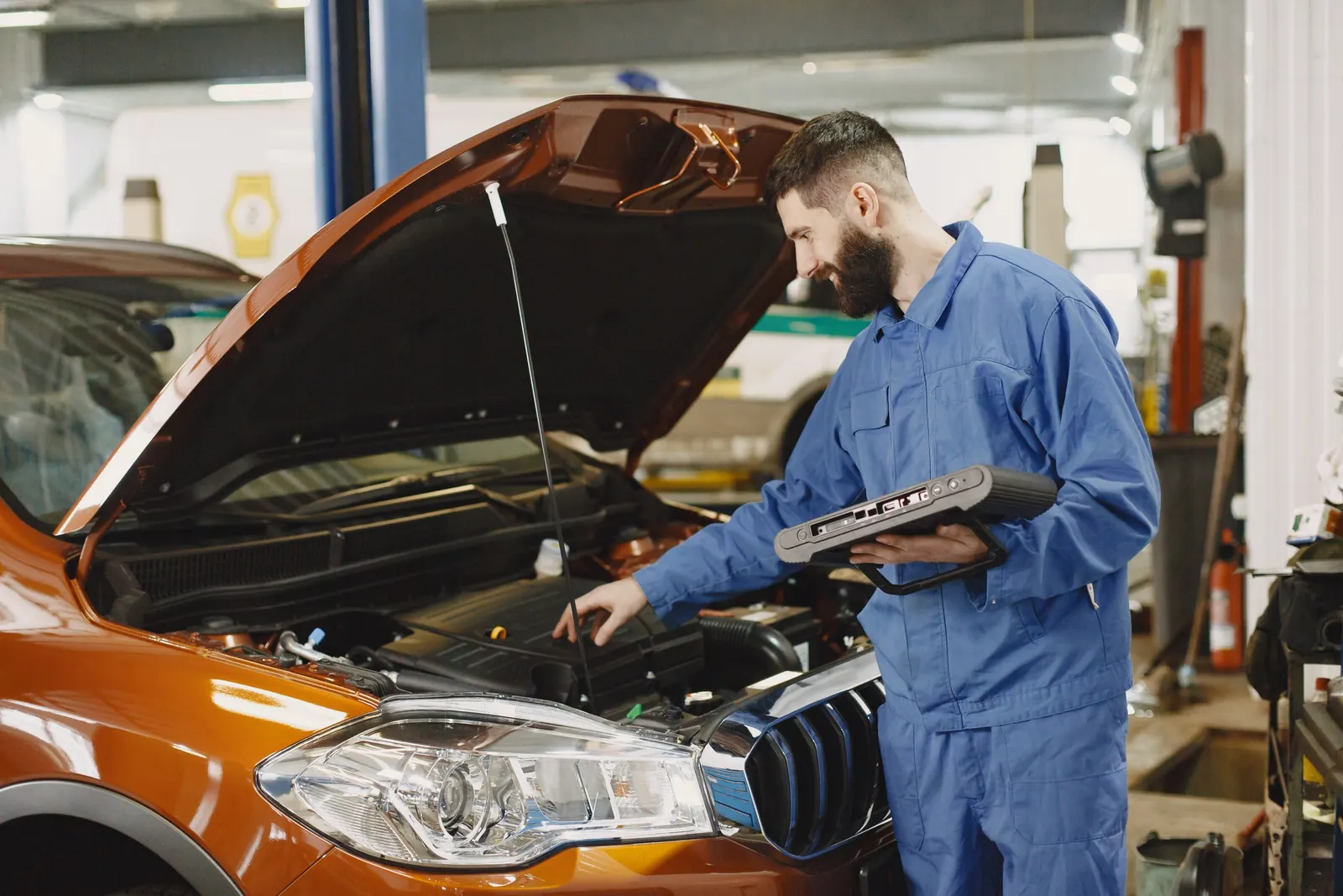 A mechanic checking an engine