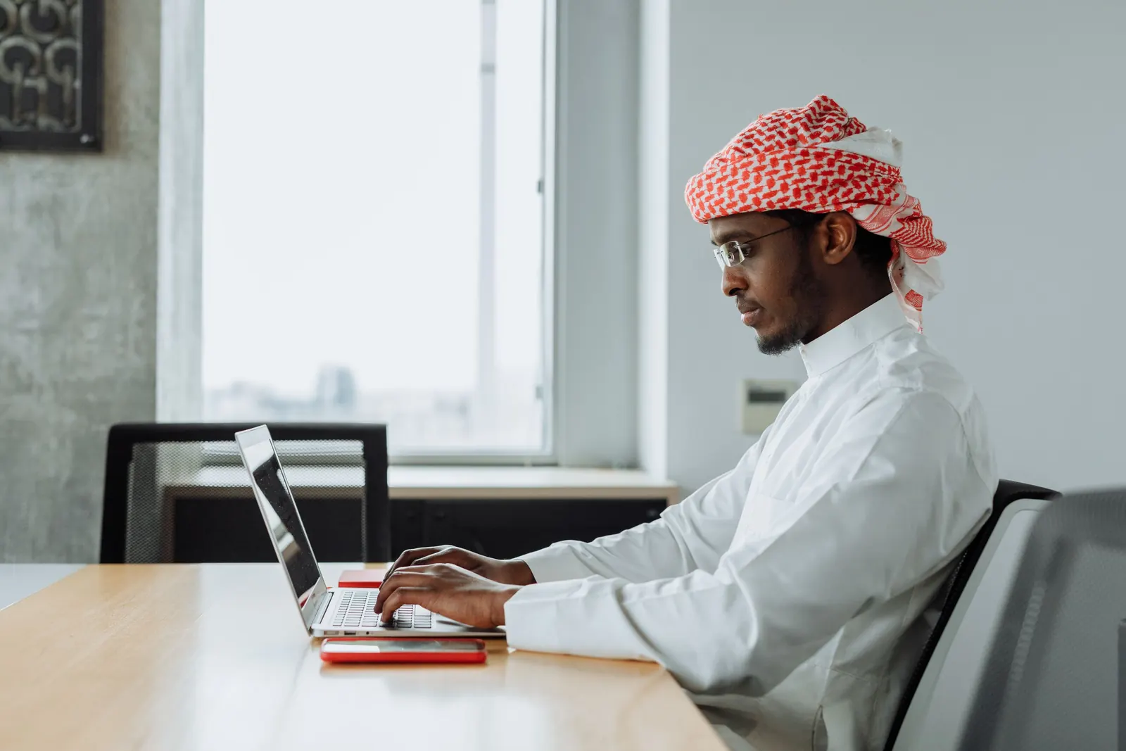 A manager reviewing reports at a desk